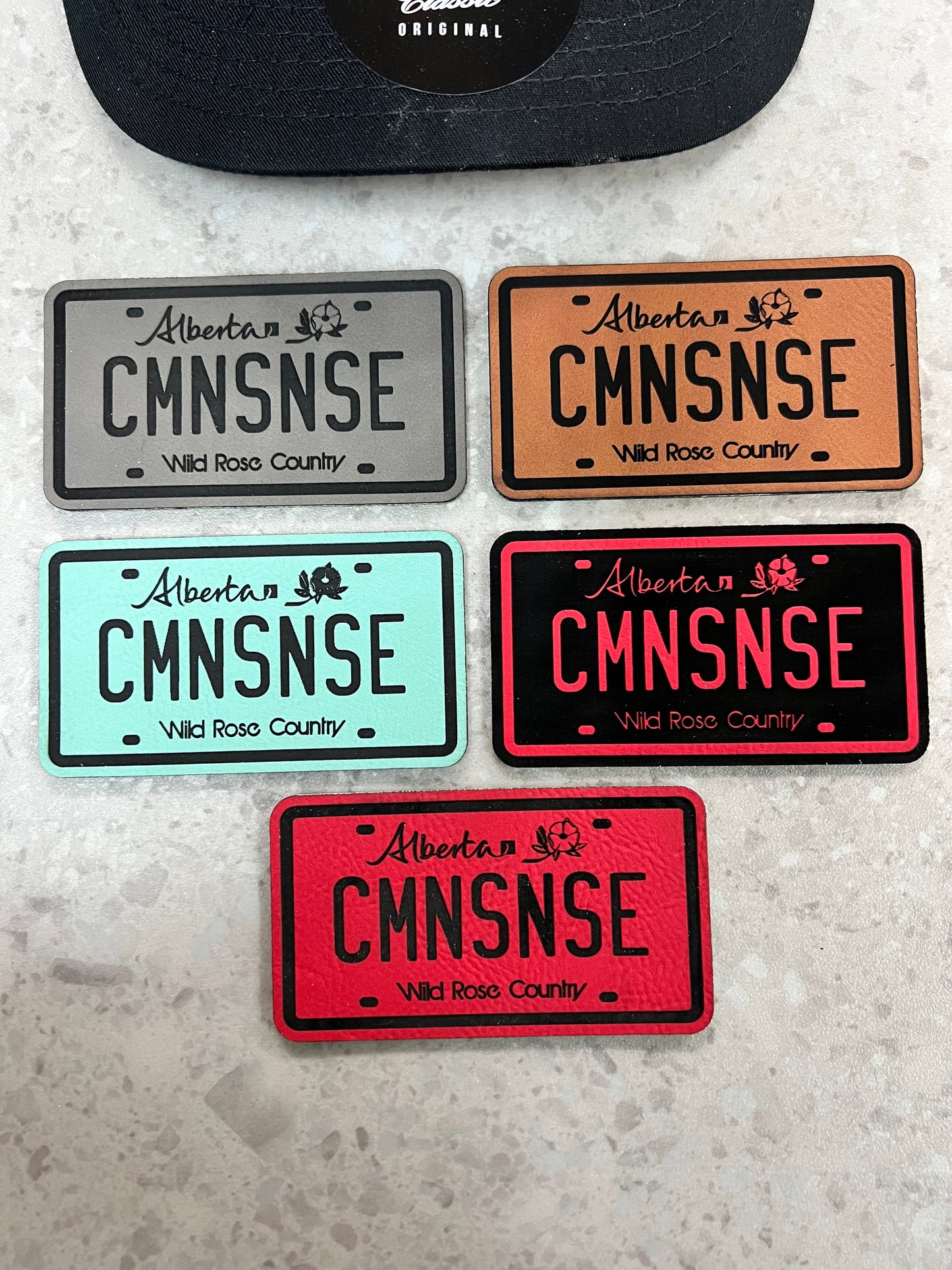 CMNSNSE Alberta Plate SnapBack Trucker