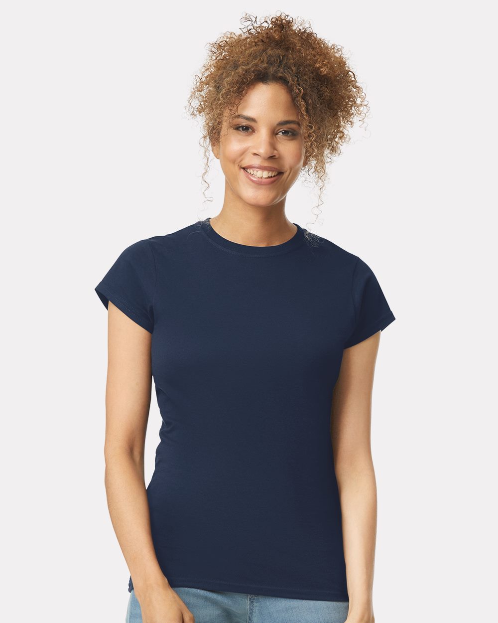 Model wearing a Gildan 64000L Softstyle women's T-shirt in Navy, front lifestyle view.