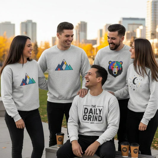 A group of friends in Calgary wearing custom sweaters with vibrant DTF printed logos