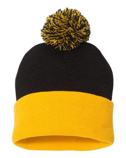 Black and yellow beanie with a pom-pom on a white background