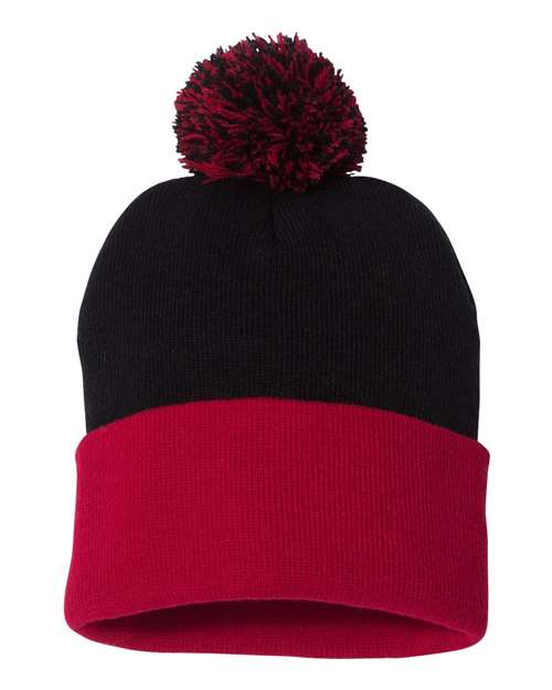 Black and red beanie with a pom-pom on a white background