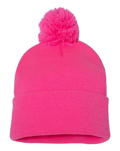 Neon Pink beanie with a pom-pom on a white background