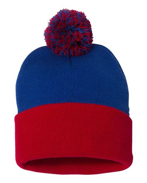 Blue and red beanie with a pom-pom on a white background