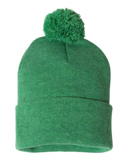 Green knit beanie with a pom-pom on a white background