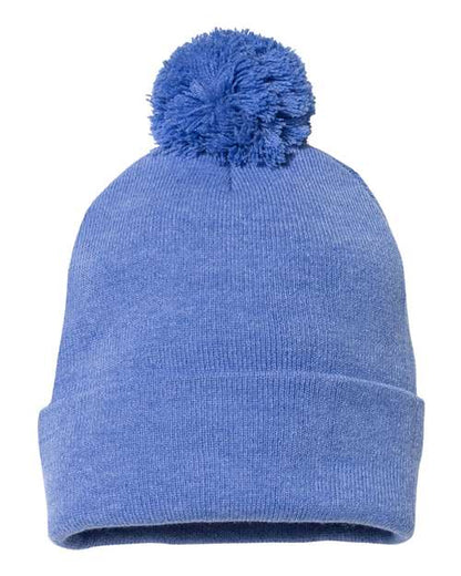 Blue knit beanie with a pom-pom on a white background