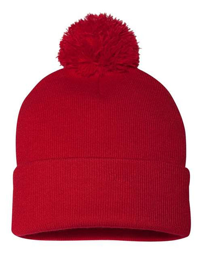 Red knit beanie with a pom-pom on a white background