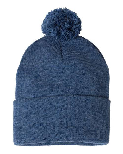 Blue knit beanie with a pom-pom on a white background