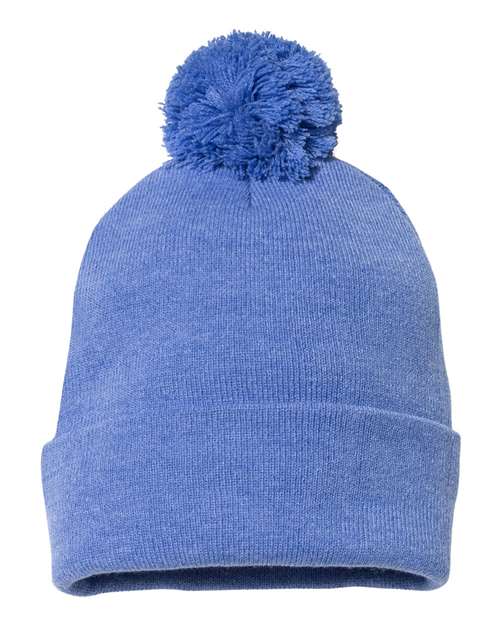 Blue knit beanie with a pom-pom on a white background