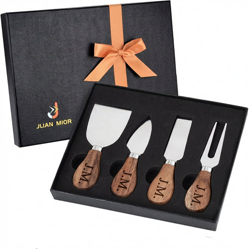 Four-piece cheese knife set with engraved wooden handles in a black gift box tied with an orange ribbon.