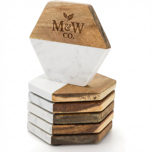 Stack of hexagonal marble and wood coasters with a sample engraved M and W Co logo.