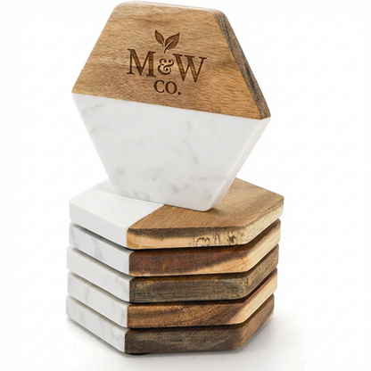 Stack of hexagonal marble and wood coasters with a sample engraved M and W Co logo.