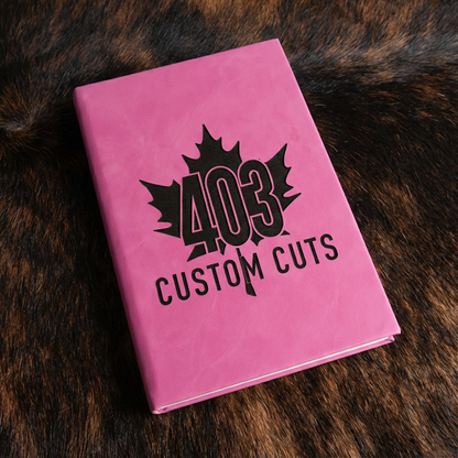 Primrose leatherette journal with the engraved 403 Custom Cuts maple leaf logo on the cover.