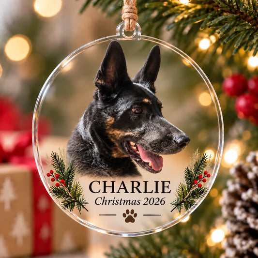 Clear acrylic pet photo Christmas ornament featuring a black dog, Charlie name, Christmas 2026 and festive greenery.