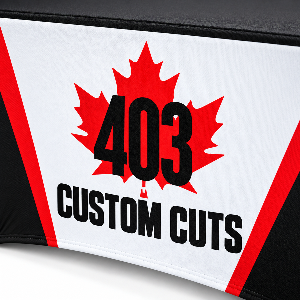 Mockup of the 403 Custom Cuts maple-leaf logo printed on the front of a custom stretch table cover