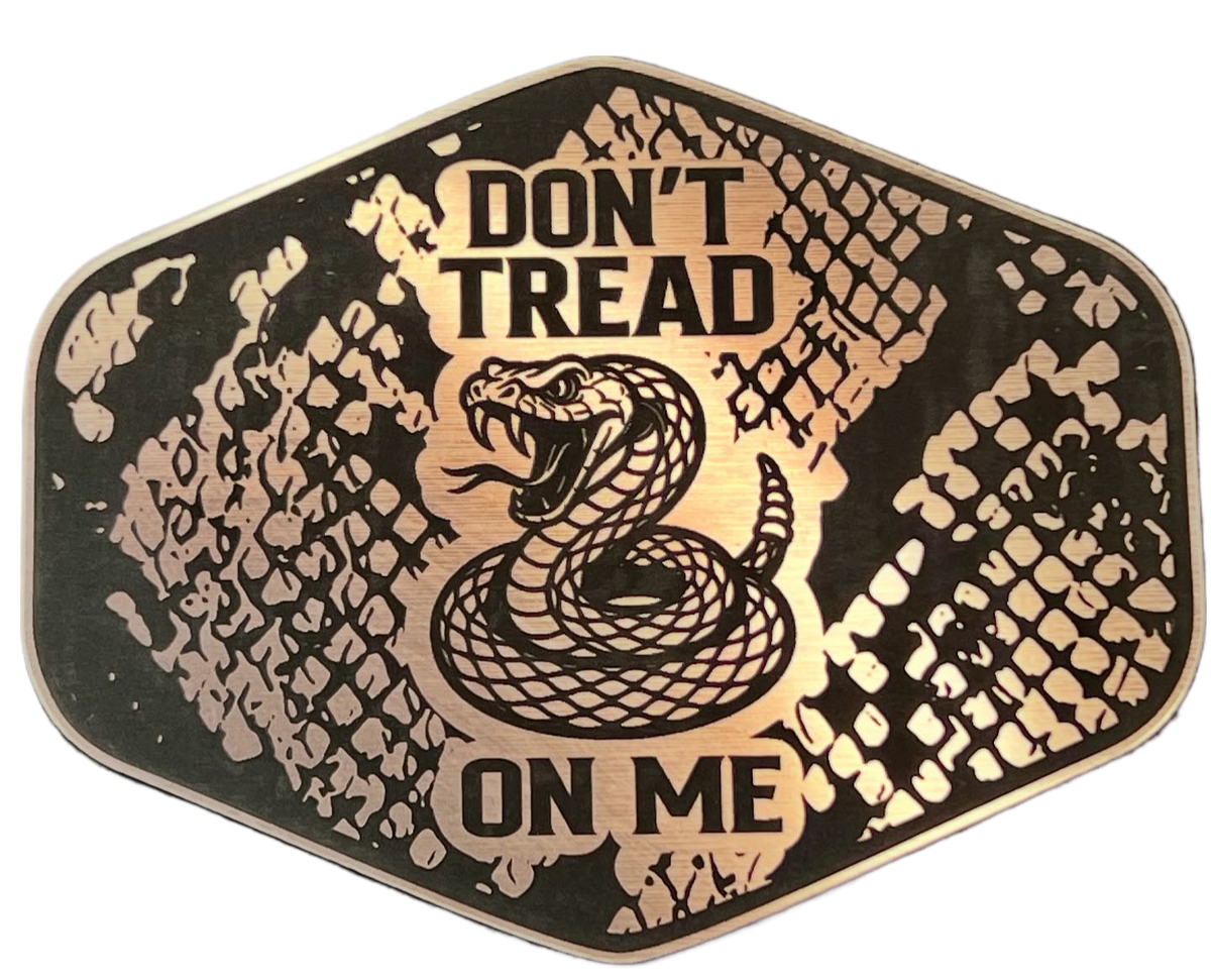 Copper Don't Tread On Me patch with a snakeskin background, coiled snake artwork, and shield shape.