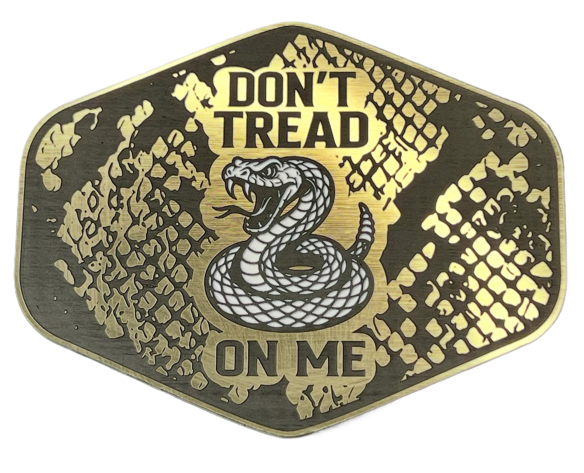 Gold Don't Tread On Me patch with a snakeskin background, coiled snake artwork, and shield shape.
