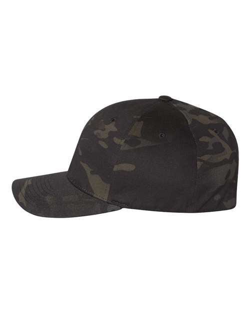 Flexfit 6277 fitted baseball hat in Multicam Black, angled side view.