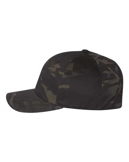 Flexfit 6277 fitted baseball hat in Multicam Black, angled side view.