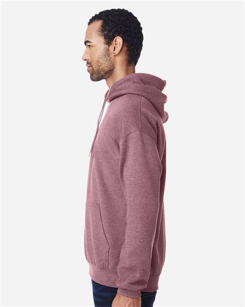 Gildan 18500 Heavy Blend pullover hoodie in Heather Dark Maroon, side on model view.