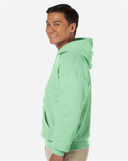 Gildan 18500 Heavy Blend pullover hoodie in Mint Green, side on model view.