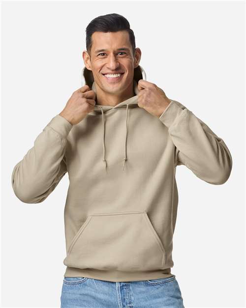 Gildan 18500 Heavy Blend pullover hoodie in Sand, front on model view.