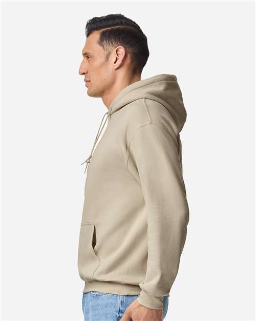 Gildan 18500 Heavy Blend pullover hoodie in Sand, side on model view.
