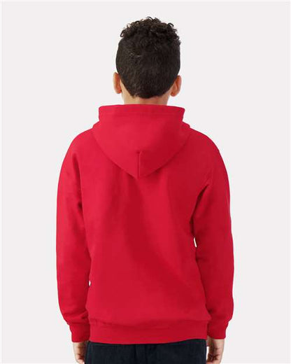 Model wearing a Gildan 18600B Heavy Blend youth full-zip hoodie in Red, back view.
