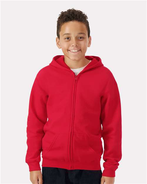 Model wearing a Gildan 18600B Heavy Blend youth full-zip hoodie in Red, front view.