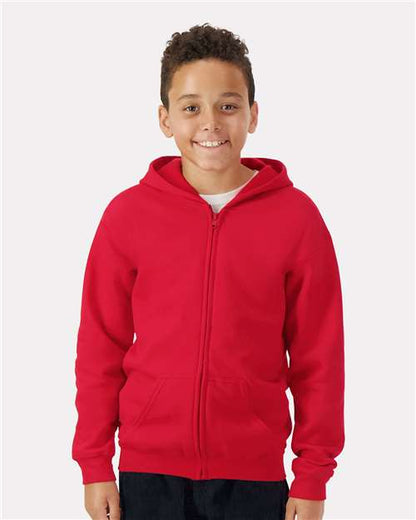 Model wearing a Gildan 18600B Heavy Blend youth full-zip hoodie in Red, front view.