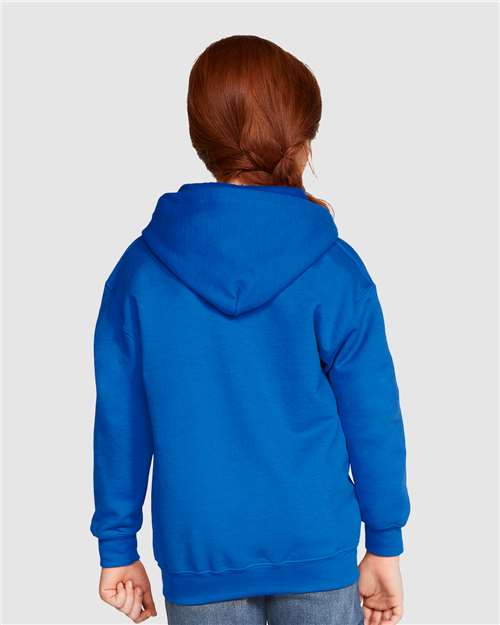 Model wearing a Gildan 18600B Heavy Blend youth full-zip hoodie in Royal, back view.