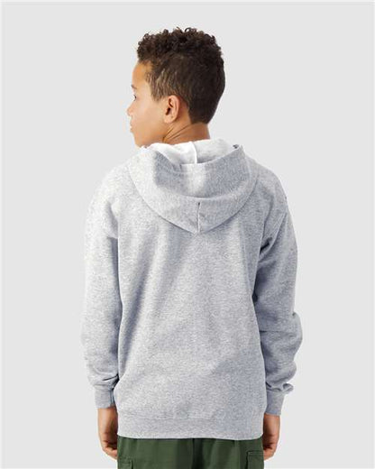 Model wearing a Gildan 18600B Heavy Blend youth full-zip hoodie in Sport Grey, back view.