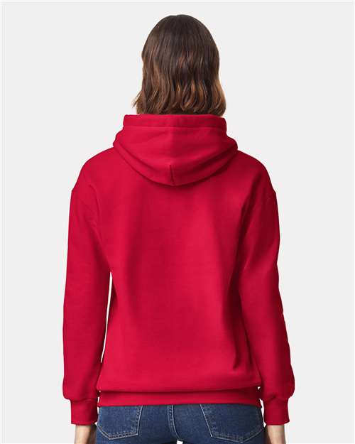 Model wearing a Gildan 19500 Maxweight Blend pullover hoodie in Cherry Red, back view.