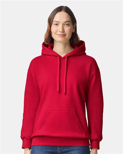 Model wearing a Gildan 19500 Maxweight Blend pullover hoodie in Cherry Red, front view.
