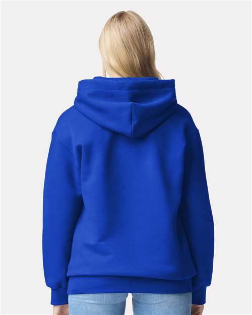 Model wearing a Gildan 19500 Maxweight Blend pullover hoodie in Deep Royal, back view.