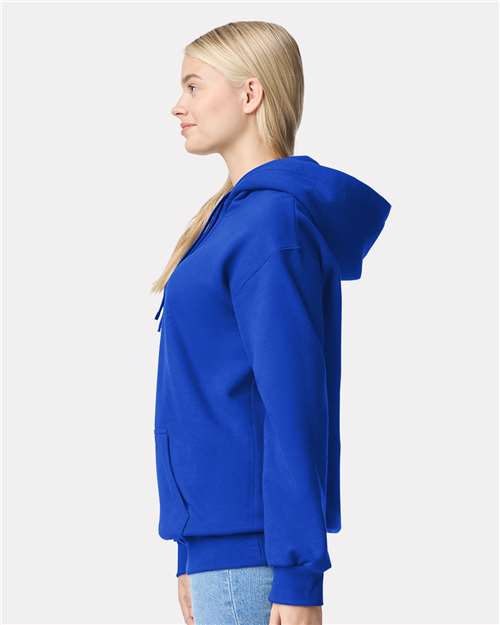 Model wearing a Gildan 19500 Maxweight Blend pullover hoodie in Deep Royal, side view.