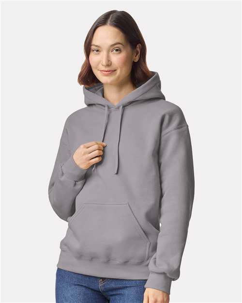 Model wearing a Gildan 19500 Maxweight Blend pullover hoodie in Gravel, front view.