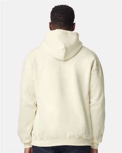Model wearing a Gildan 19500 Maxweight Blend pullover hoodie in Off White, back view.