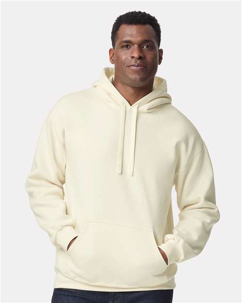 Model wearing a Gildan 19500 Maxweight Blend pullover hoodie in Off White, front view.
