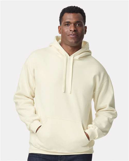 Model wearing a Gildan 19500 Maxweight Blend pullover hoodie in Off White, front view.