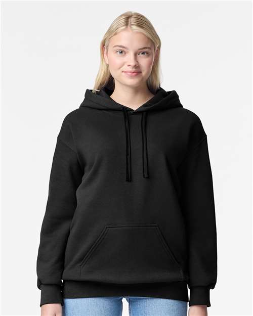 Model wearing a Gildan 19500 Maxweight Blend pullover hoodie in Pitch Black, front view.