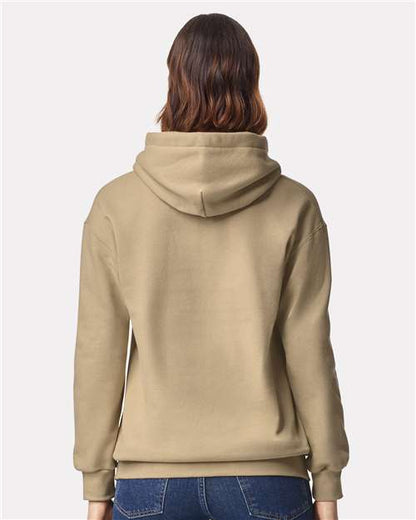 Model wearing a Gildan 19500 Maxweight Blend pullover hoodie in Tan, back view.
