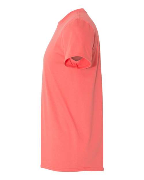Gildan 64000 Softstyle T-shirt in Coral Silk, side view showing the short sleeve and hem.