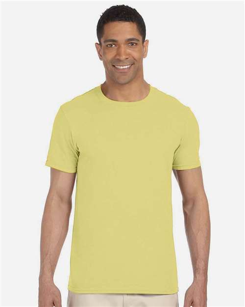 Model wearing a Gildan 64000 Softstyle T-shirt in Cornsilk, front view.