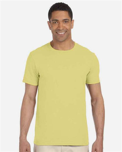 Model wearing a Gildan 64000 Softstyle T-shirt in Cornsilk, front view.