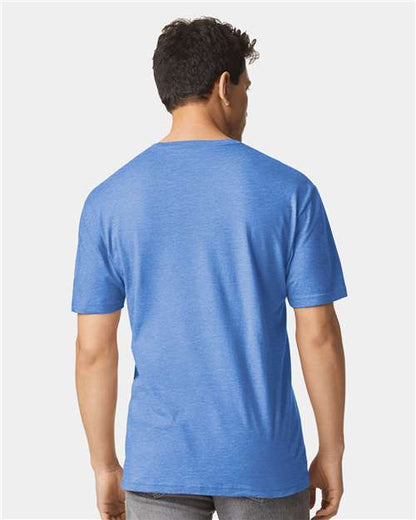 Model wearing a Gildan 64000 Softstyle T-shirt in Heather Royal, back view.