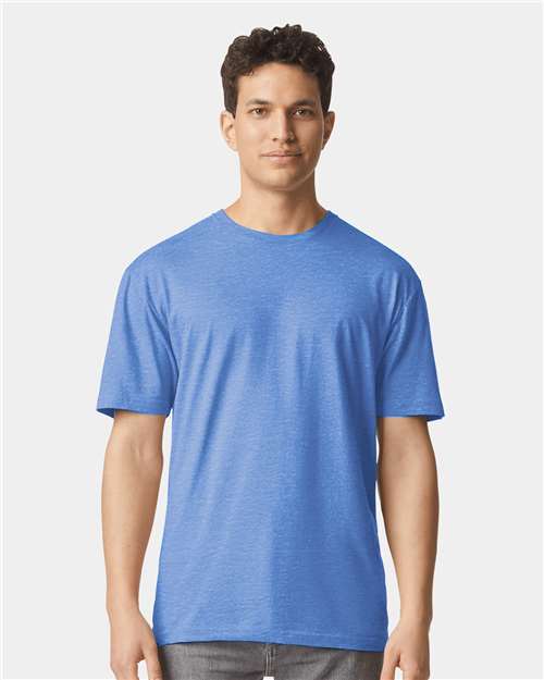 Model wearing a Gildan 64000 Softstyle T-shirt in Heather Royal, front view.
