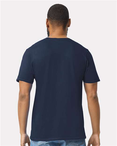 Model wearing a Gildan 64000 Softstyle T-shirt in Navy, back view.
