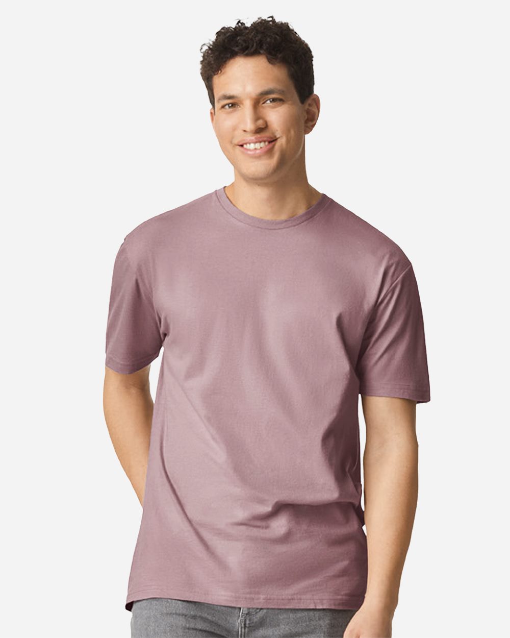 Model wearing a Gildan 64000 Softstyle T-shirt in Paragon, front lifestyle view.
