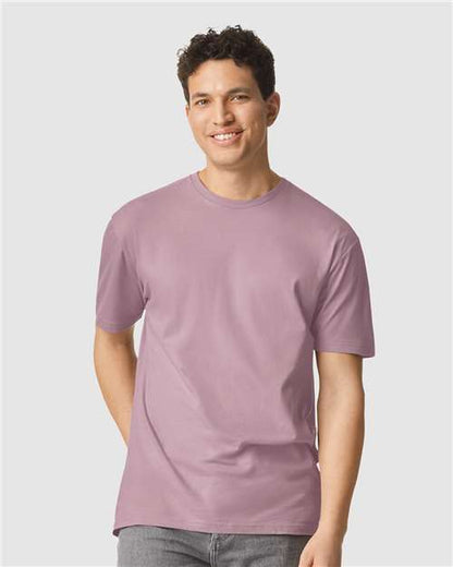 Model wearing a Gildan 64000 Softstyle T-shirt in Paragon, front view.