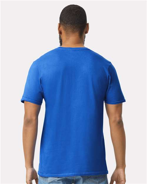 Model wearing a Gildan 64000 Softstyle T-shirt in Royal, back view.